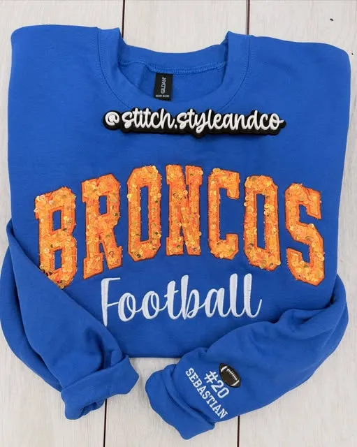 Royal blue sweatshirt with orange sequin BRONCOS, Football in script, #20 Sebastian on the sleeve